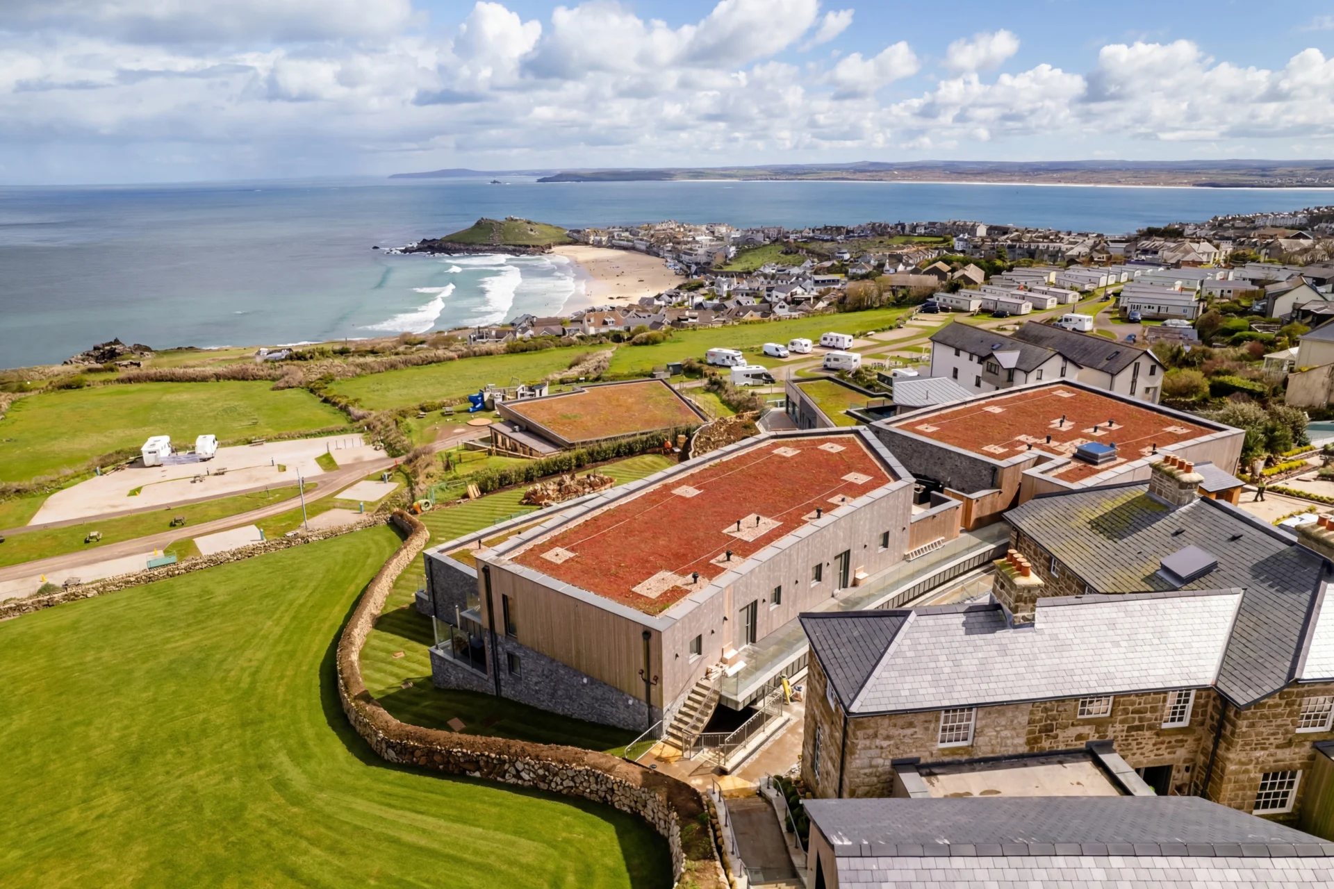 Coastal town with beach and buildings aerial view