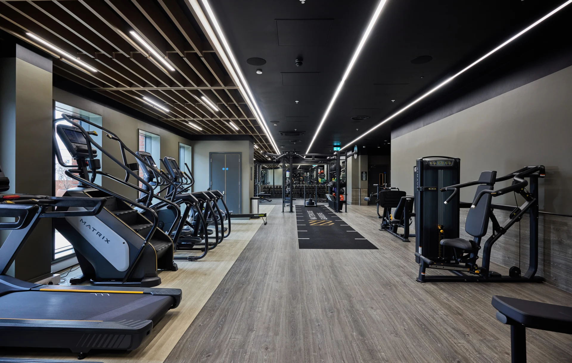 Modern gym with fitness equipment and treadmills