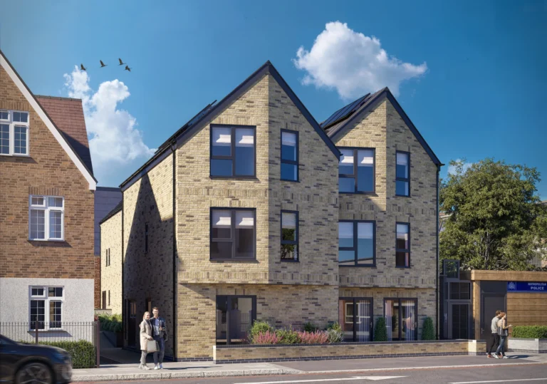 Modern brick residential building on sunny street.