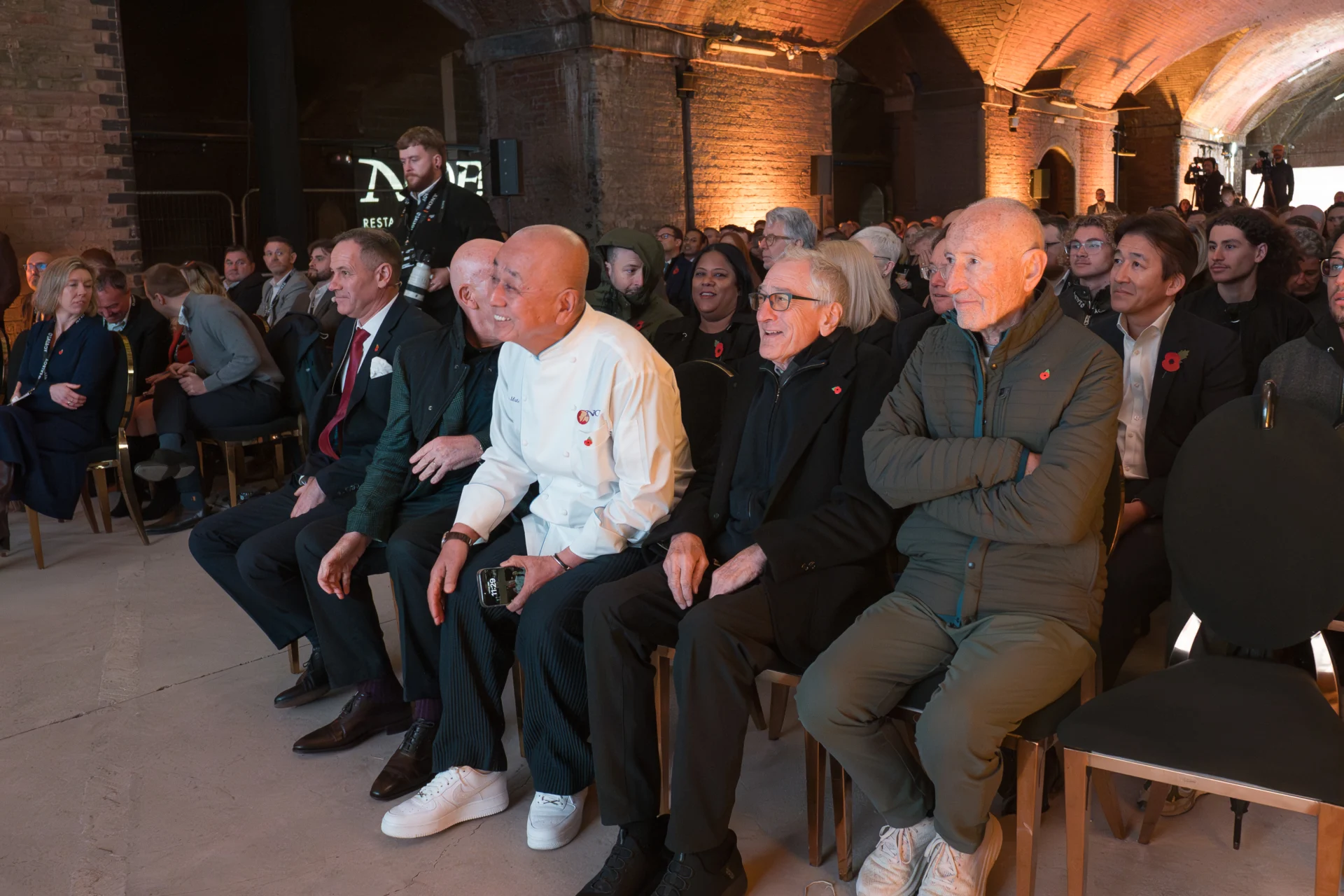 Audience at event in brick hall