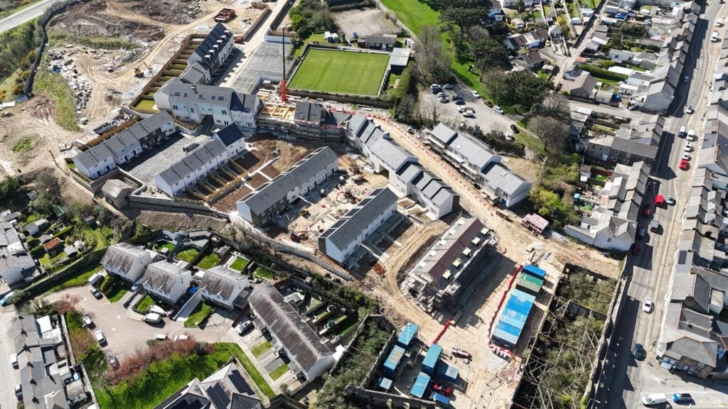 Aerial view of construction site in residential neighborhood.
