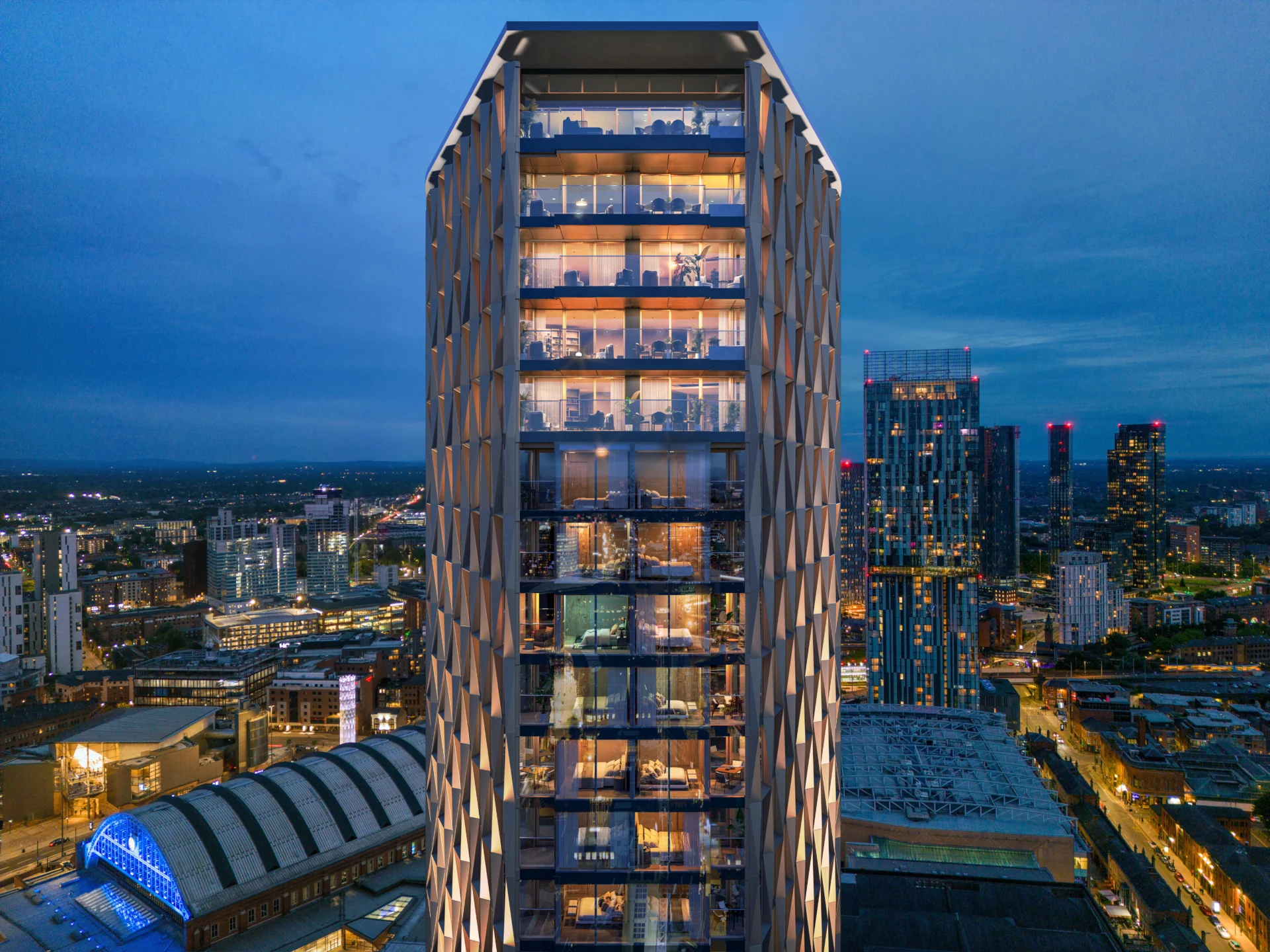 Illuminated modern tower overlooking city skyline at dusk